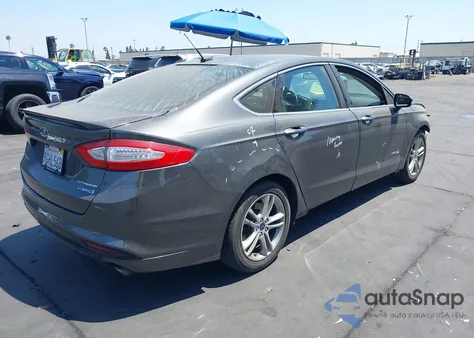 2016 Ford Fusion Hybrid Titanium from USA, damaged, VIN 3FA6P0RUXGR281509
